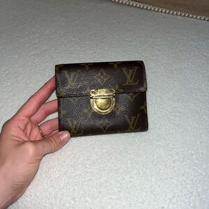 Louis Vuitton monogram wallet with zipper and card slots